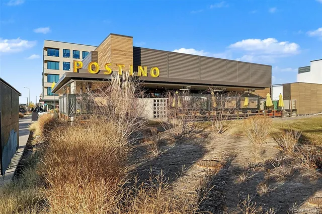 a front view of a building with garden