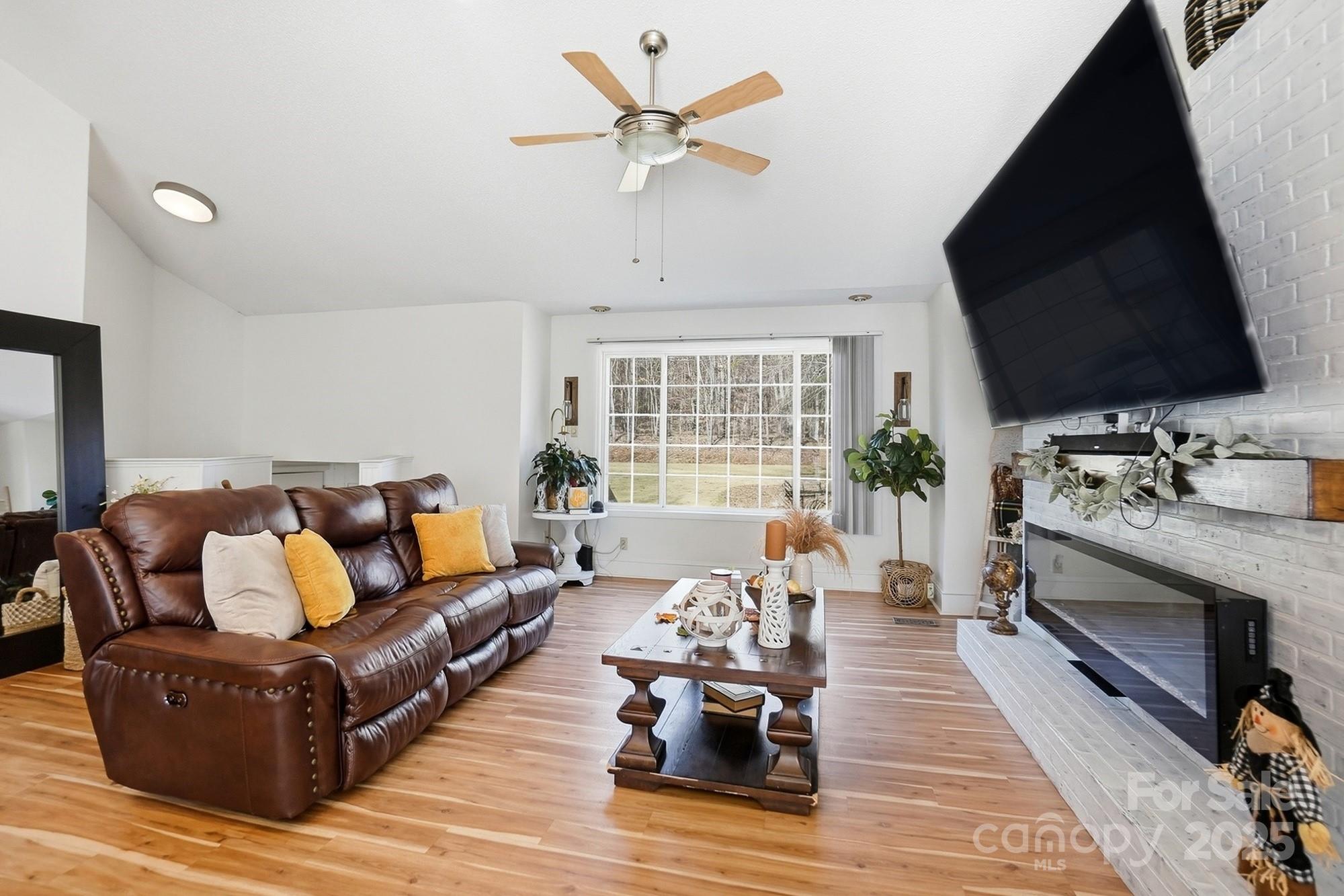 2012 Bethlehem Road Kings Mountain, NC 28086 - Photo 16 of 45 a living room with furniture fireplace and a flat screen tv