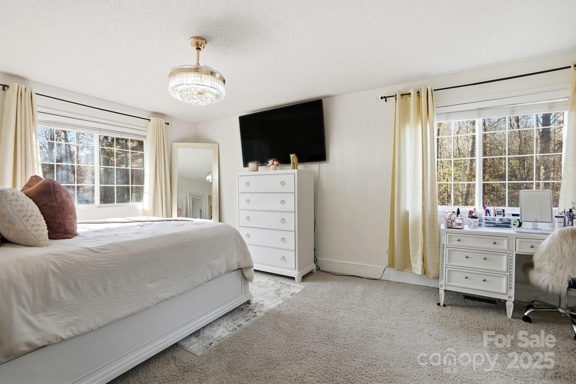2012 Bethlehem Road Kings Mountain, NC 28086 - Photo 19 of 45 a bedroom with a bed and a flat screen tv