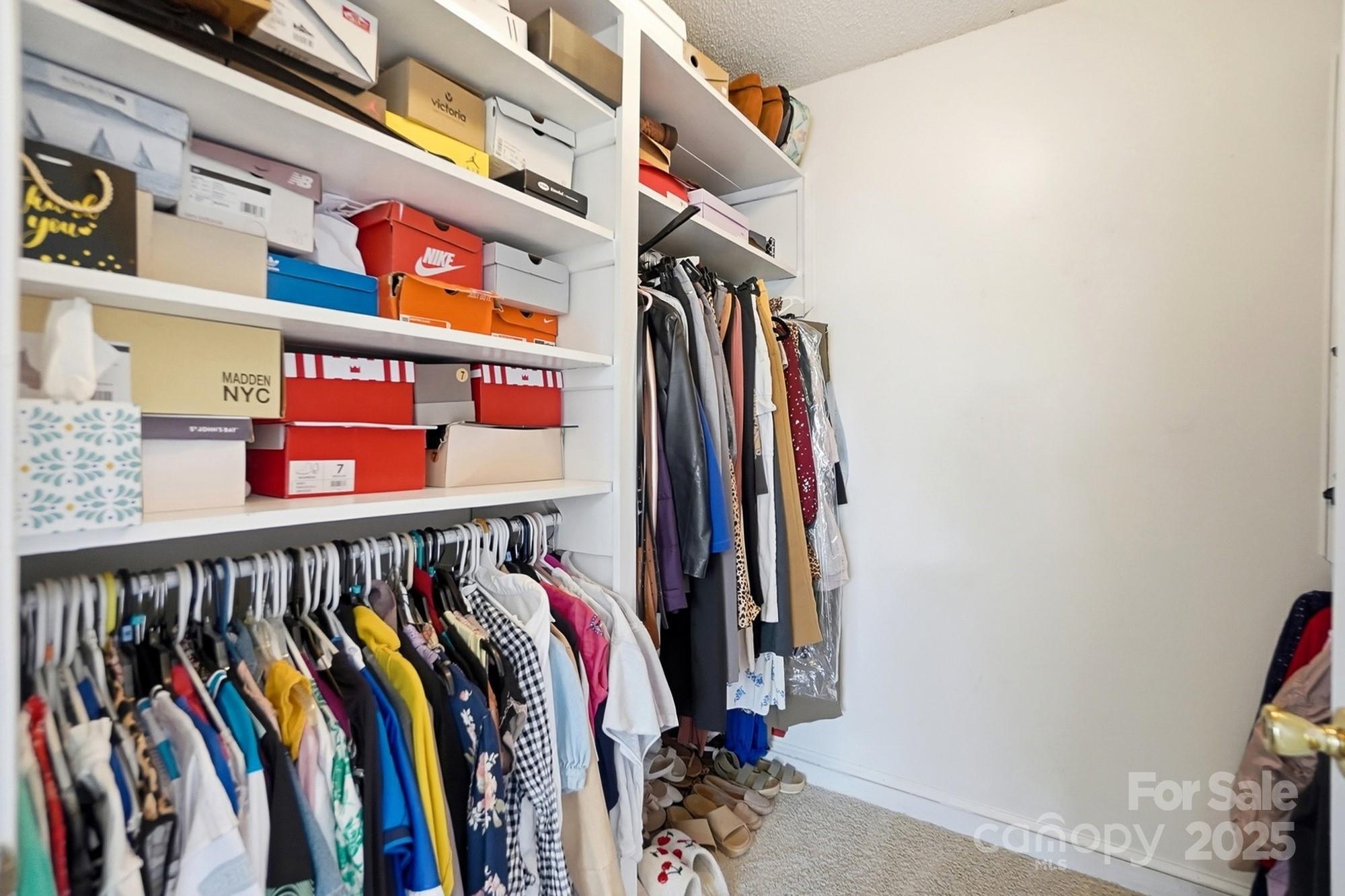 2012 Bethlehem Road Kings Mountain, NC 28086 - Photo 22 of 45 a view of walk in closet with clothes and shoes