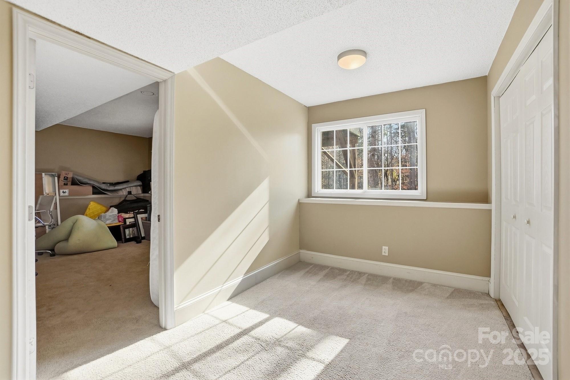 2012 Bethlehem Road Kings Mountain, NC 28086 - Photo 28 of 45 a view of empty room with wooden floor and fan