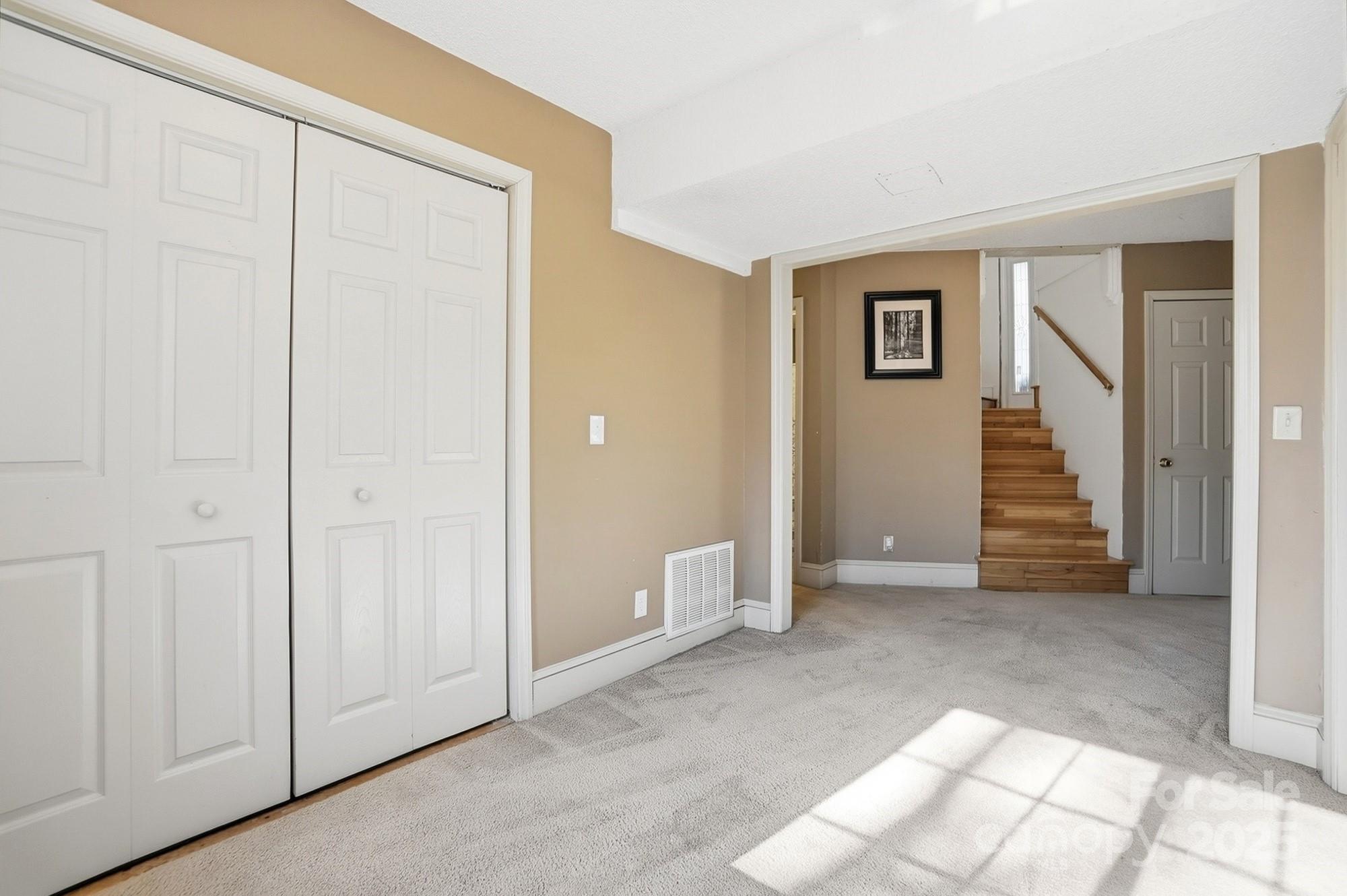2012 Bethlehem Road Kings Mountain, NC 28086 - Photo 30 of 45 an empty room with windows and stairs