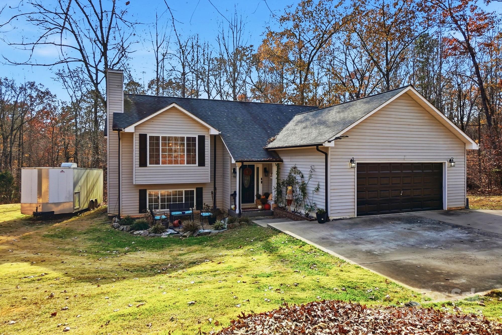 2012 Bethlehem Road Kings Mountain, NC 28086 - Photo 4 of 45 a view of a house with a yard patio and fire pit
