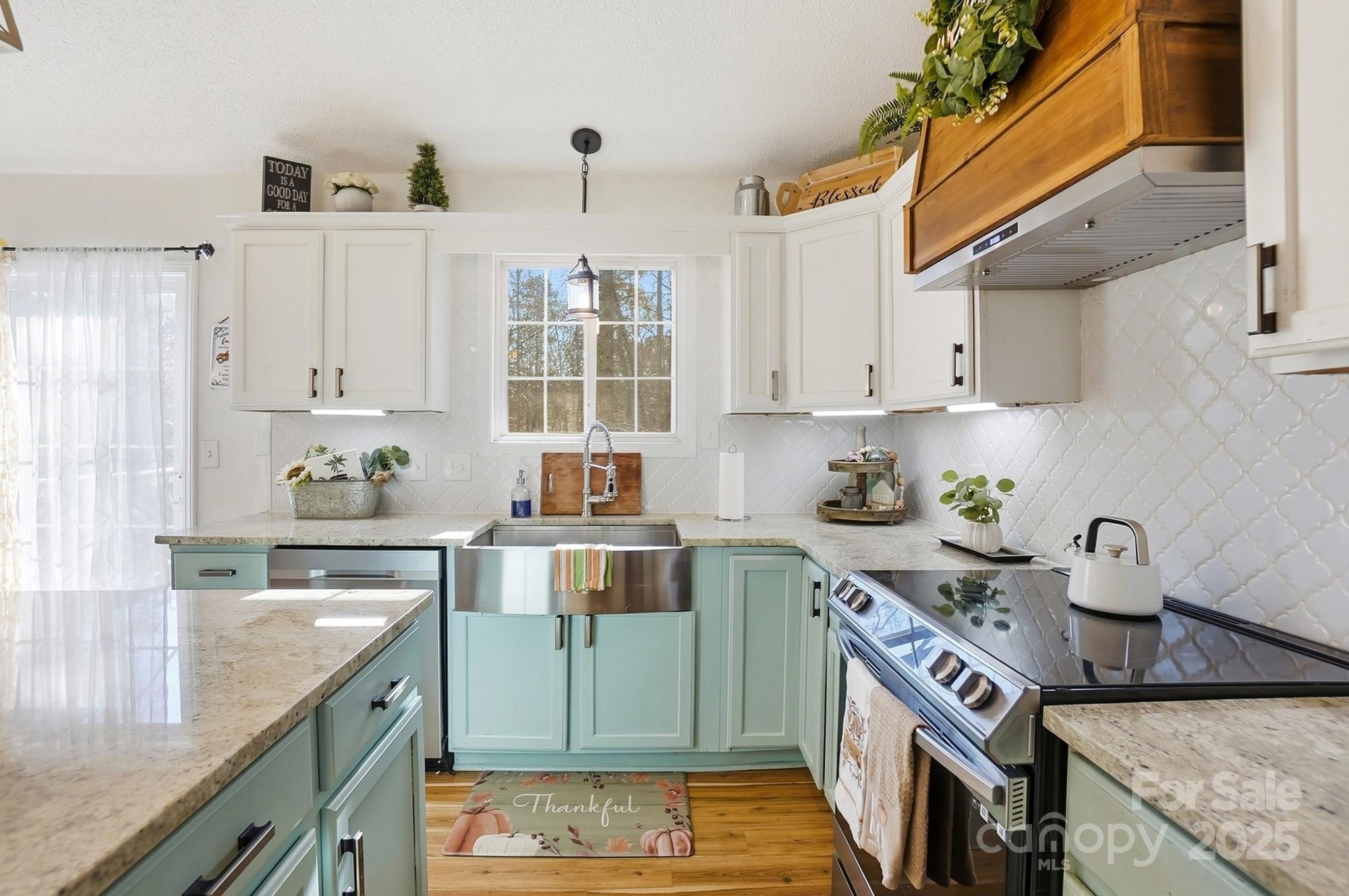 2012 Bethlehem Road Kings Mountain, NC 28086 - Photo 9 of 45 a kitchen with stainless steel appliances granite countertop a sink stove and cabinets