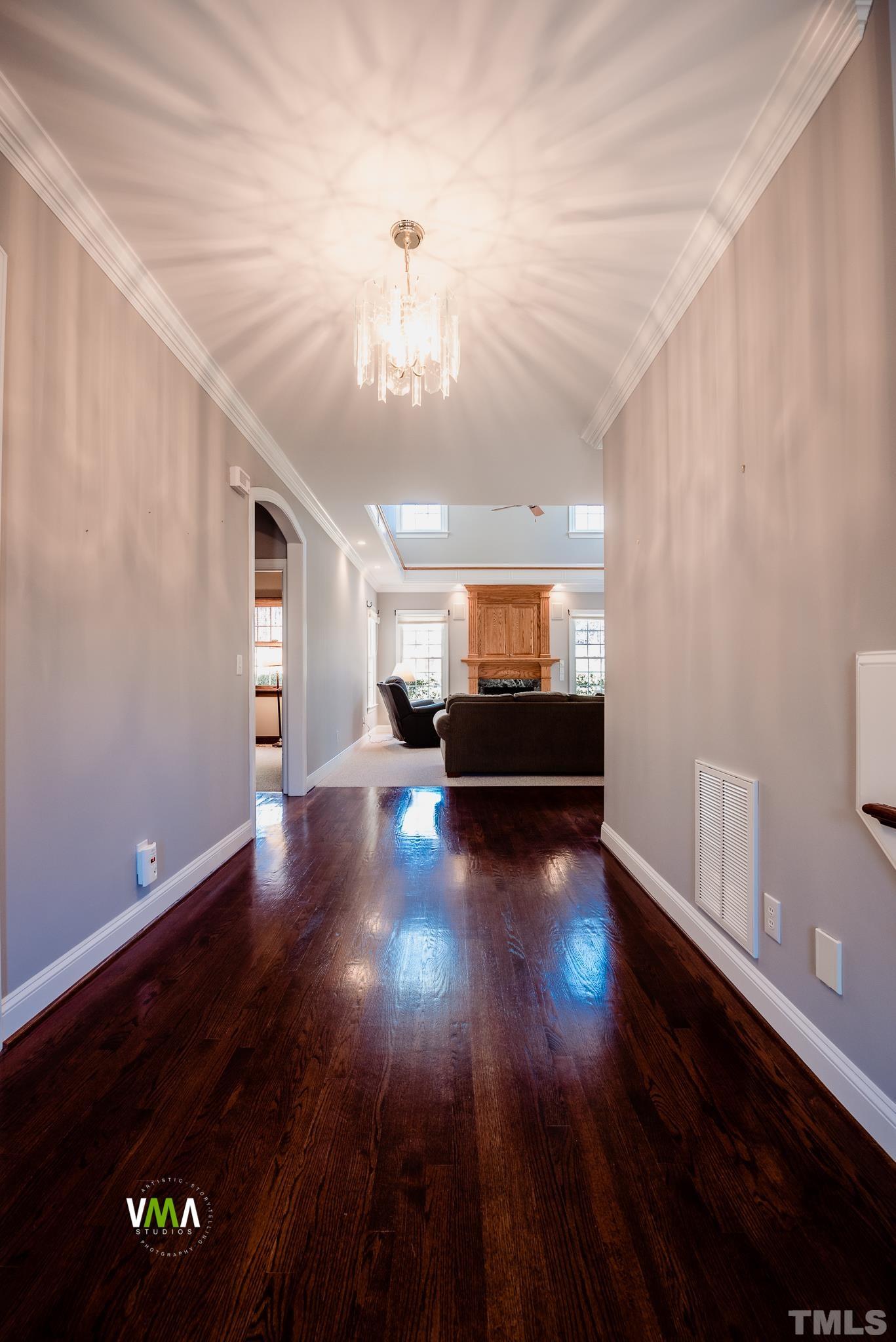 5417 Levering Mill Road Apex, NC 27539 - Photo 16 of 39 a view of empty room with wooden floor
