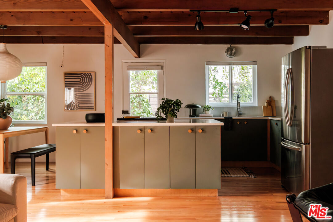 940 East Arroyo Terrace Alhambra, CA 91801 - Photo 11 of 54 a kitchen with stainless steel appliances granite countertop a refrigerator and a sink