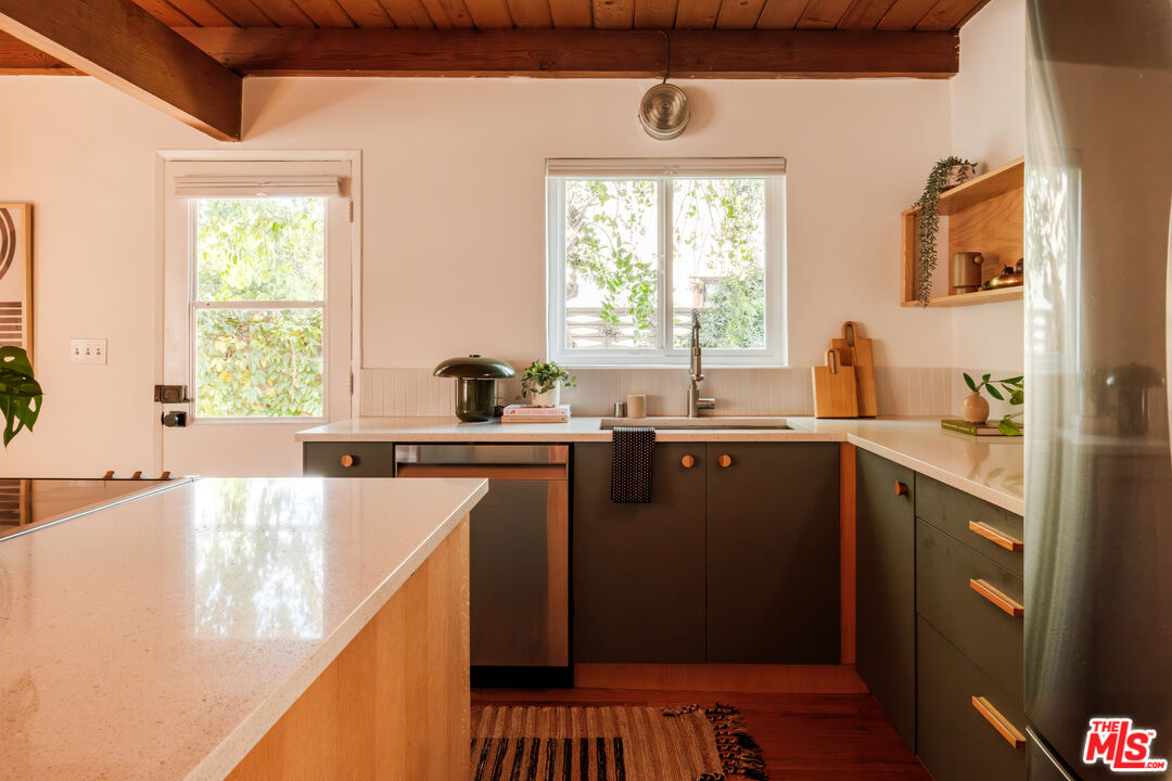 940 East Arroyo Terrace Alhambra, CA 91801 - Photo 14 of 54 a kitchen with a sink a window and cabinets