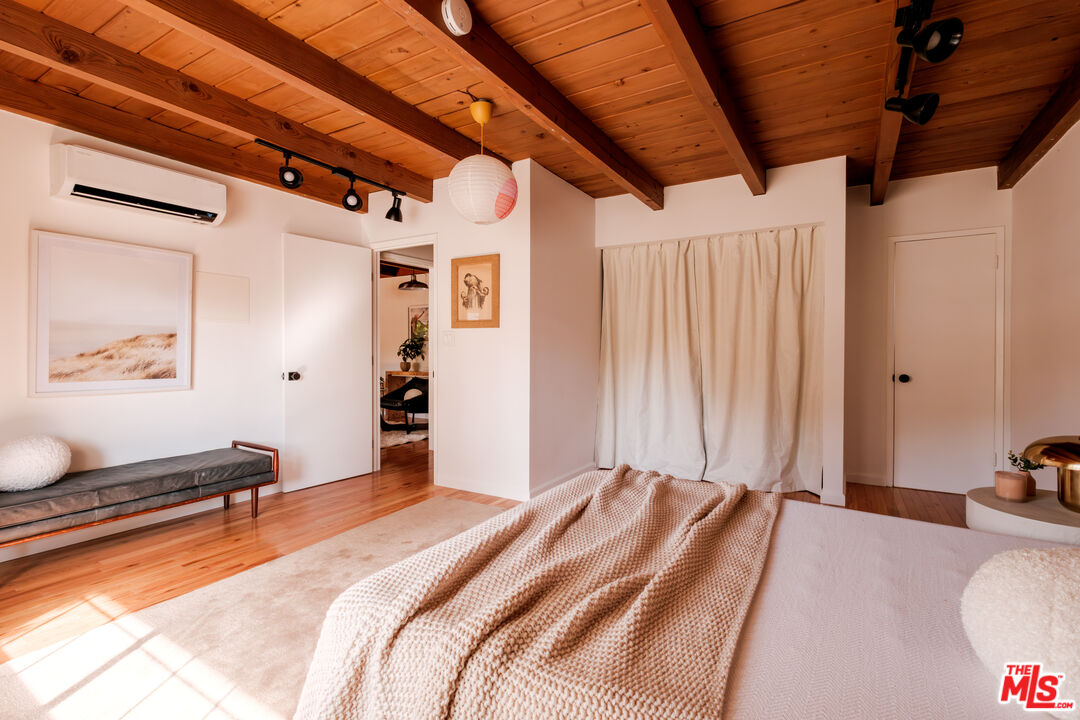 940 East Arroyo Terrace Alhambra, CA 91801 - Photo 23 of 54 a bedroom with a bed and a chandelier