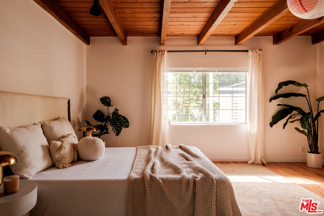 940 East Arroyo Terrace Alhambra, CA 91801 - Photo 24 of 54 a bed sitting in a bedroom next to a window
