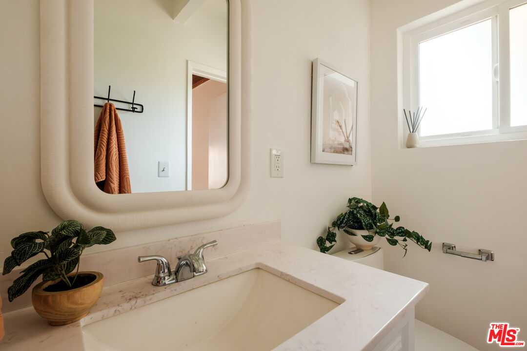 940 East Arroyo Terrace Alhambra, CA 91801 - Photo 26 of 54 a bathroom with a tub sink and mirror