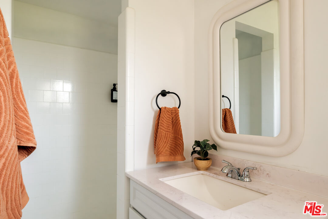 940 East Arroyo Terrace Alhambra, CA 91801 - Photo 27 of 54 a bathroom with a sink and a mirror