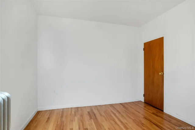 a view of room with wooden floor