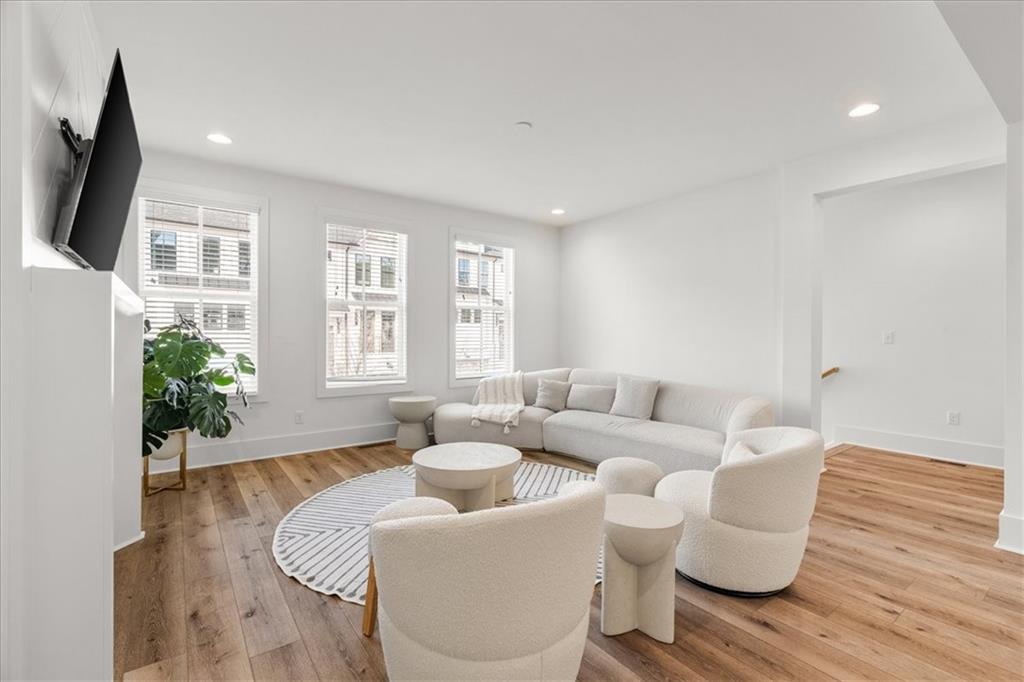 5862 Westin Road Atlanta, GA 30328 - Photo 12 of 43 a living room with furniture and a large window