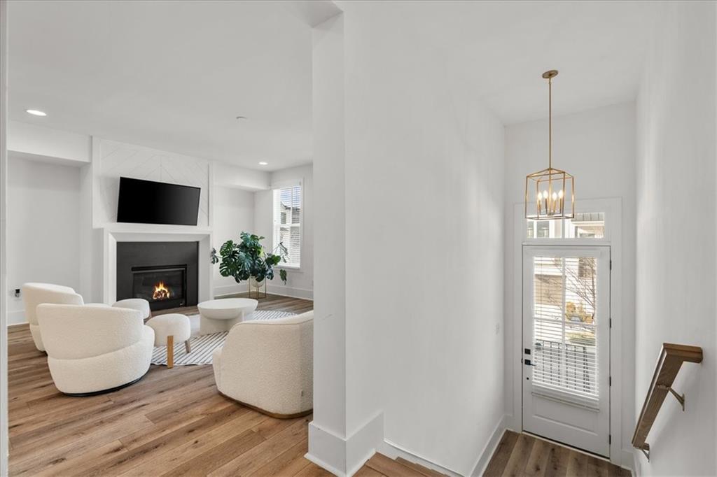 5862 Westin Road Atlanta, GA 30328 - Photo 14 of 43 a living room with furniture and a fireplace