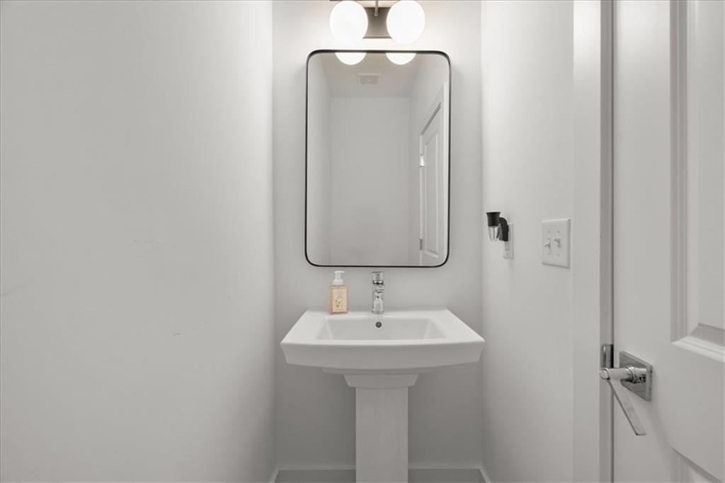 5862 Westin Road Atlanta, GA 30328 - Photo 15 of 43 a bathroom with a sink and mirror