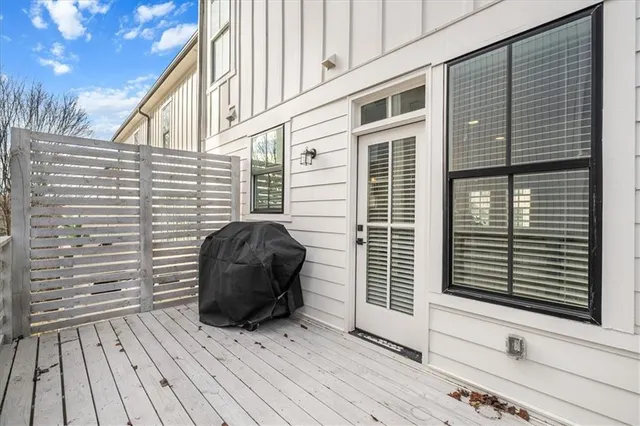 a view of a two chairs and a tables in the balcony