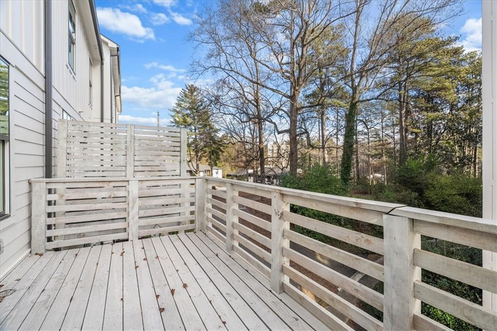 5862 Westin Road Atlanta, GA 30328 - Photo 17 of 43 a view of a roof deck with wooden floor and fence