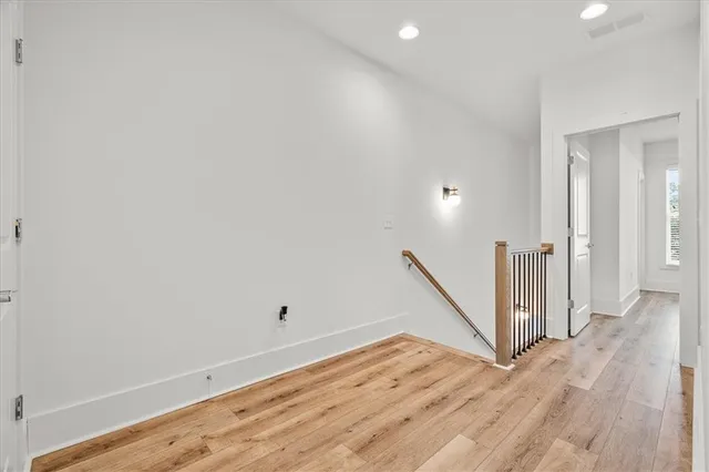 a view of a room with wooden floor