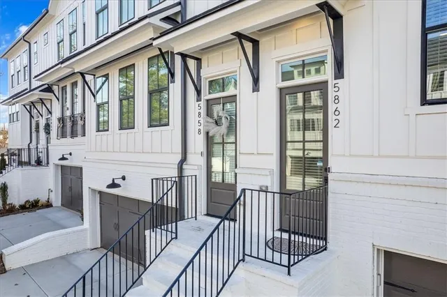 a view of a balcony with wooden floor and furniture