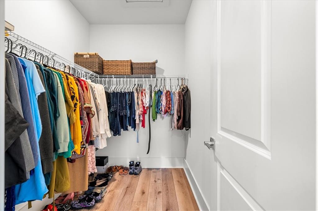 5862 Westin Road Atlanta, GA 30328 - Photo 24 of 43 a view of walk in closet with clothes and shoes