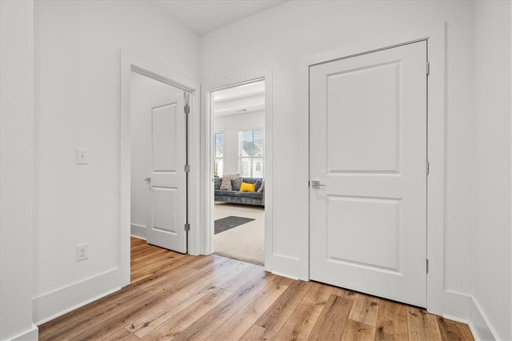 5862 Westin Road Atlanta, GA 30328 - Photo 25 of 43 a view of a hallway with wooden floor