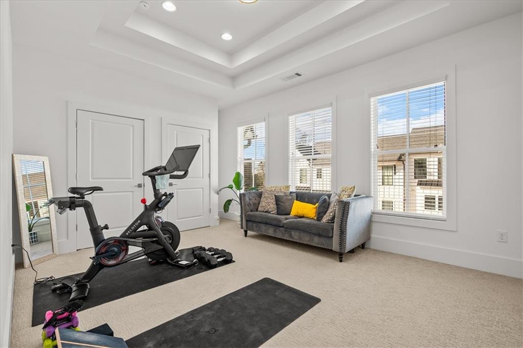 5862 Westin Road Atlanta, GA 30328 - Photo 27 of 43 a living room with furniture gym equipment and a large window