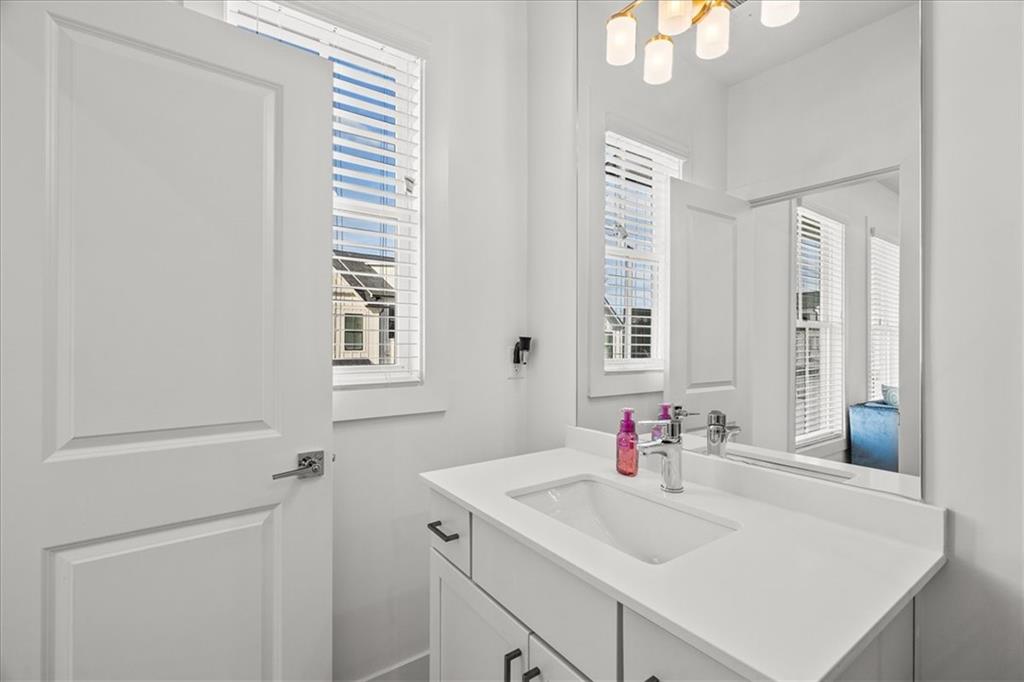 5862 Westin Road Atlanta, GA 30328 - Photo 30 of 43 a bathroom with a sink and a mirror