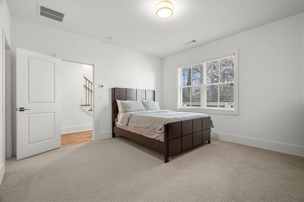 5862 Westin Road Atlanta, GA 30328 - Photo 33 of 43 a room with a bed and a window