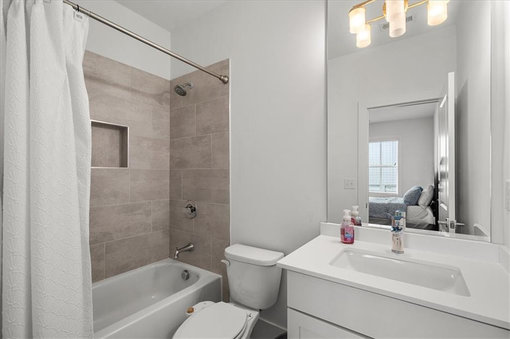 5862 Westin Road Atlanta, GA 30328 - Photo 35 of 43 a bathroom with a sink a toilet and shower