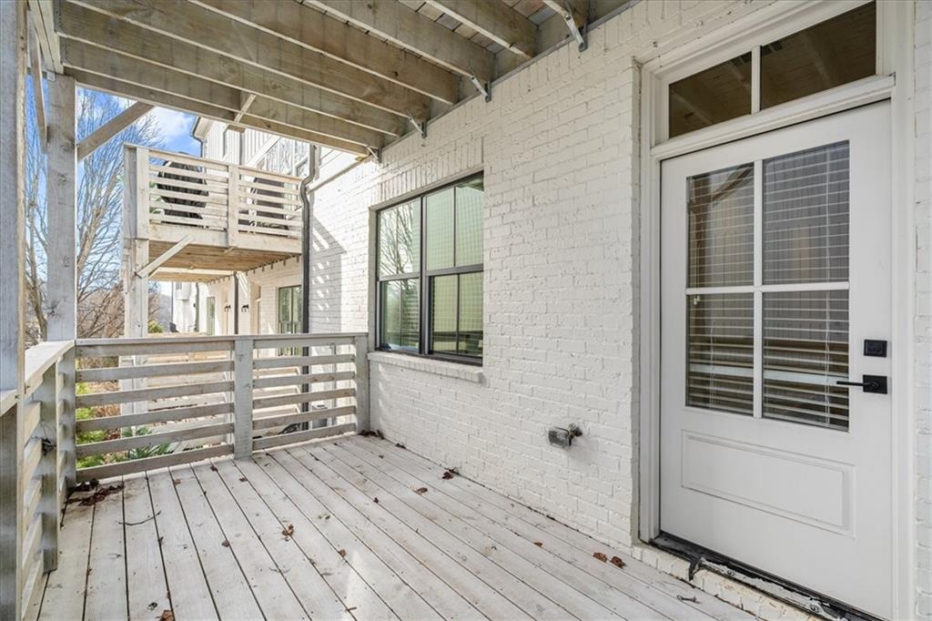 5862 Westin Road Atlanta, GA 30328 - Photo 37 of 43 a view of a balcony with wooden floor and windows