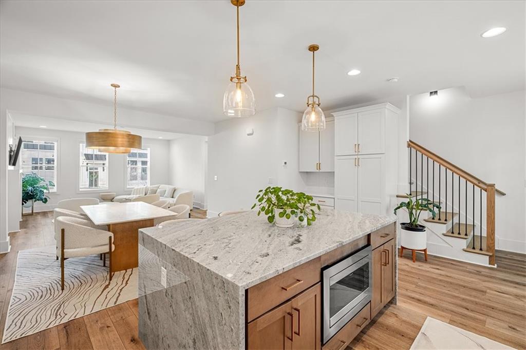 5862 Westin Road Atlanta, GA 30328 - Photo 6 of 43 an open kitchen with a table and chairs