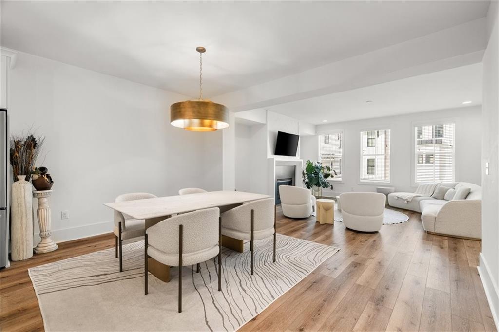 5862 Westin Road Atlanta, GA 30328 - Photo 10 of 43 a view of a dining room with furniture window and wooden floor