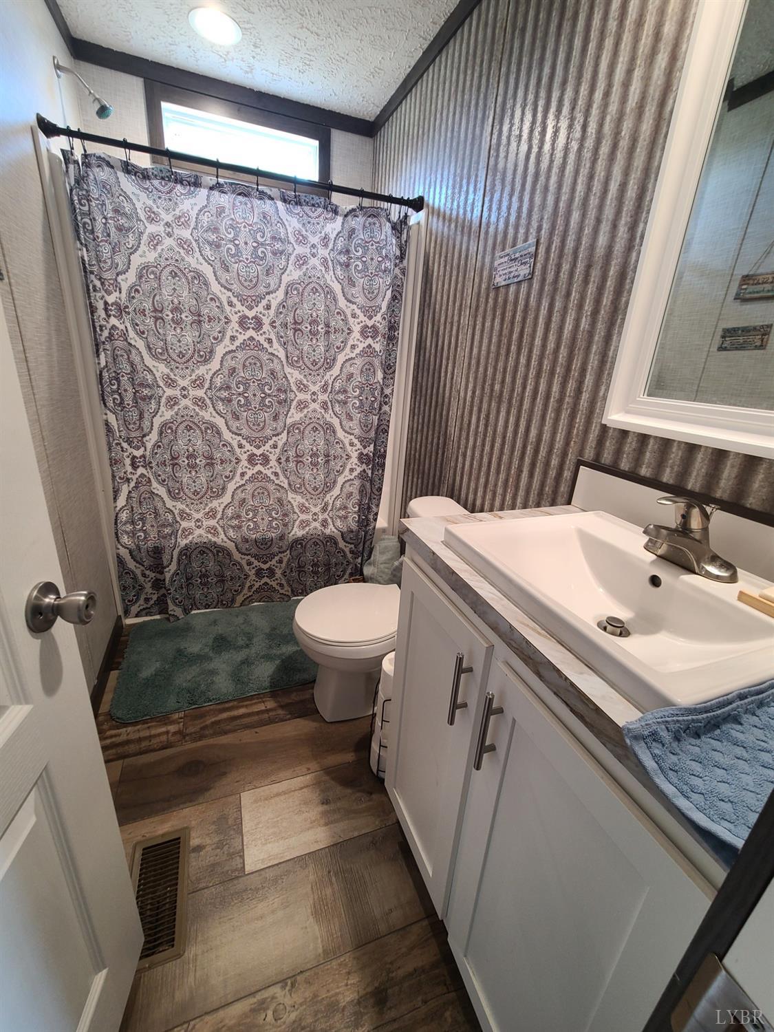 344 Midway Road Phenix, VA 23959 - Photo 25 of 37 a bathroom with a sink toilet and shower