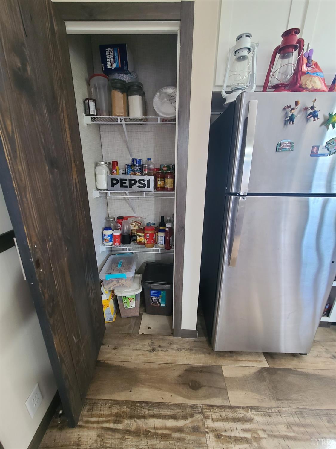 344 Midway Road Phenix, VA 23959 - Photo 8 of 37 a kitchen with a refrigerator and cabinets