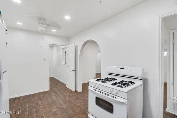 a kitchen with a stove and a refrigerator