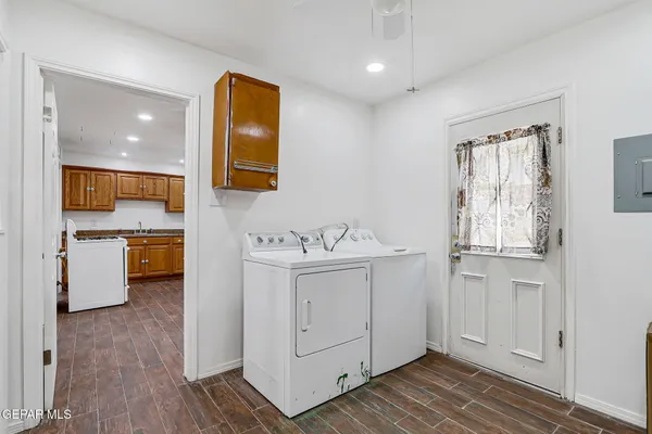 a bathroom with a sink a mirror and a vanity