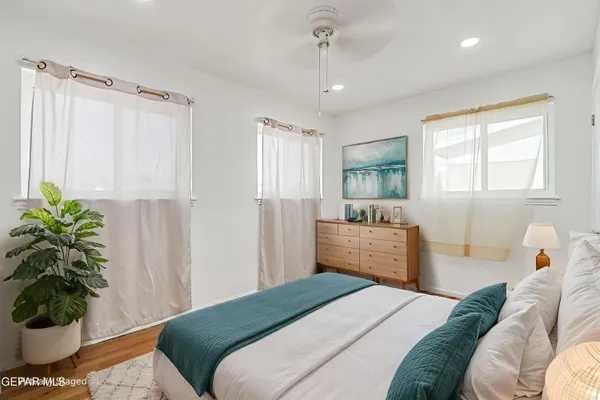 a bedroom with a bed and a couch