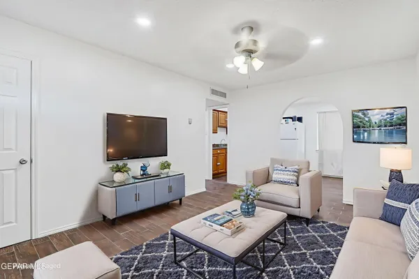 a living room with furniture and a flat screen tv