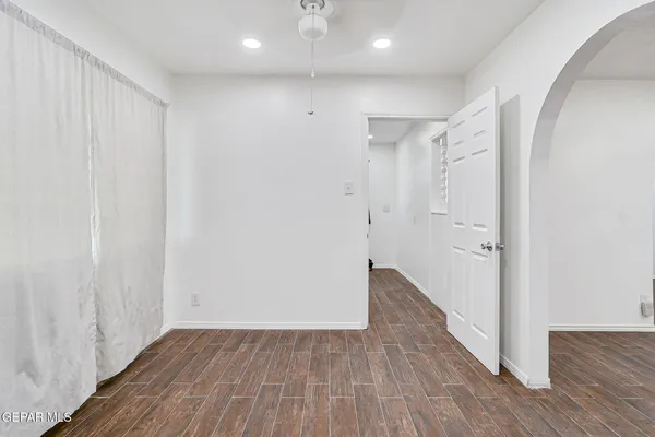 a view of hallway with wooden floor