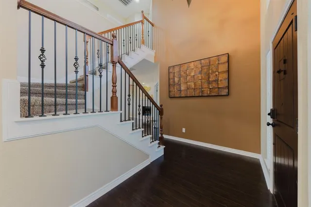 a view of an empty room with a fan