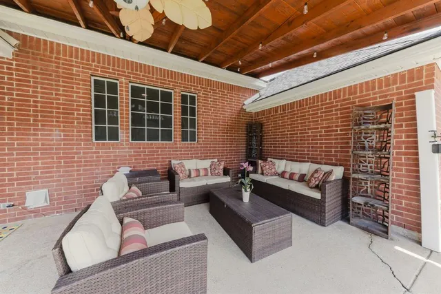 a front view of a house with outdoor seating