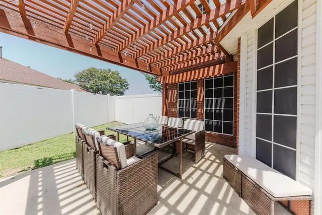 a swimming pool with outdoor seating and yard