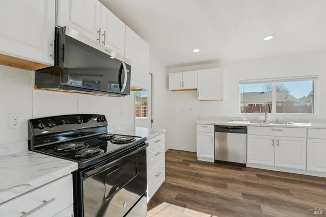 a view of a livingroom with wooden floor