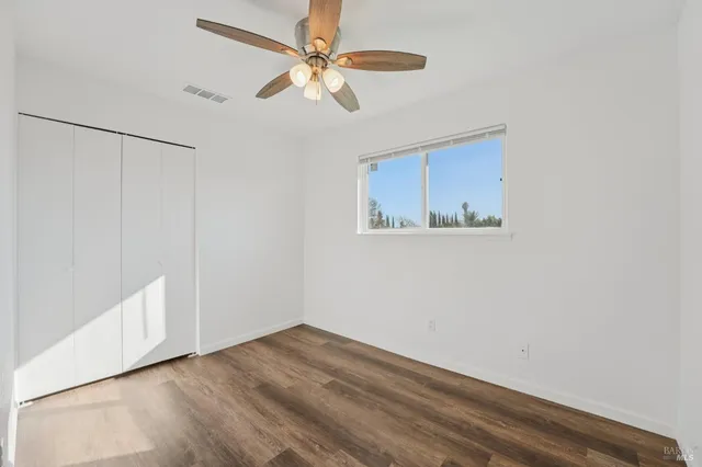 a bathroom with a sink a mirror a toilet and bathtub