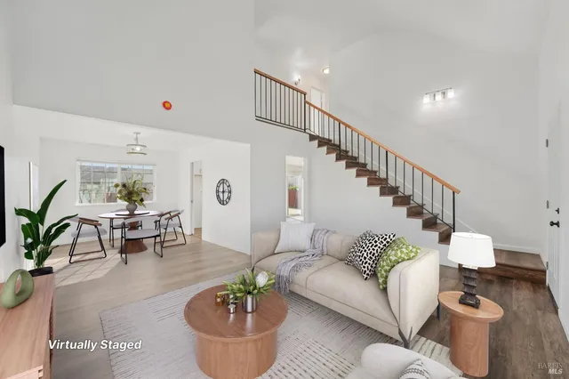 a view of an entryway with wooden floor