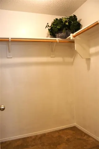 a view of a small space with wooden floor