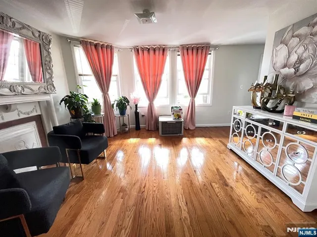 a view of a refrigerator in kitchen and wooden floor