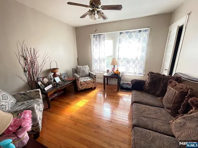 a view of a living room with furniture and a window