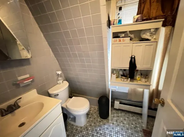 a view of backyard with table and chairs and wooden fence