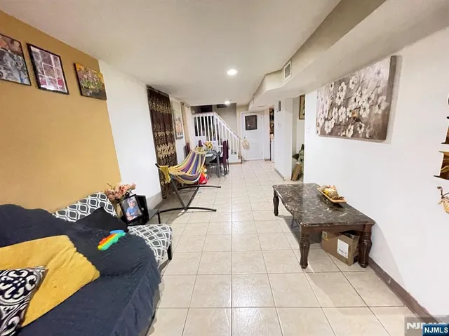 a kitchen with a sink appliances and cabinets